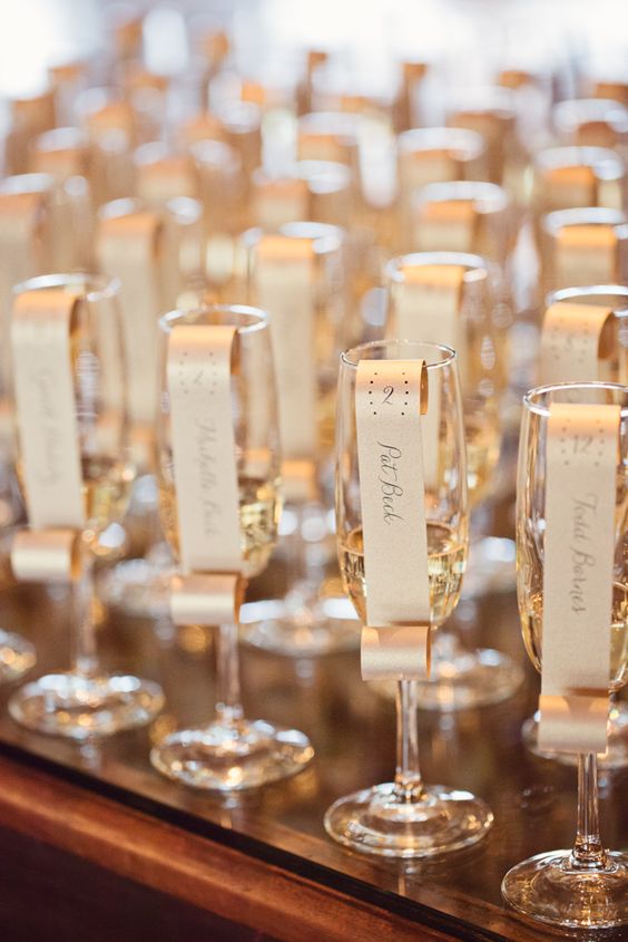 champagne flutes as escort cards